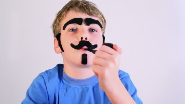 Little boy imitates pipe smoking — Stock Video