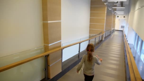 Little girl walks by corridor — Stock Footage Little girl walks by corridor Stock Footage
