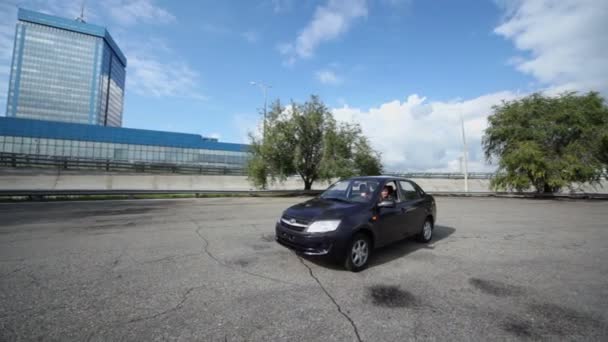 Man rides by car Lada Granta — Stock Video