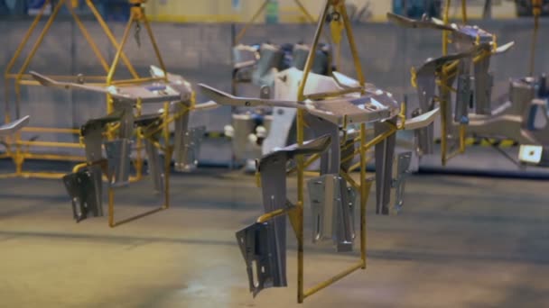 Car parts hangs on moving conveyer — Stock Video