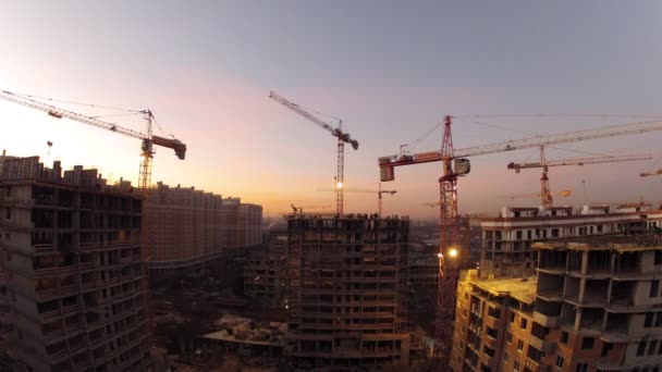 Cranes with lamps on construction site — Stock Video