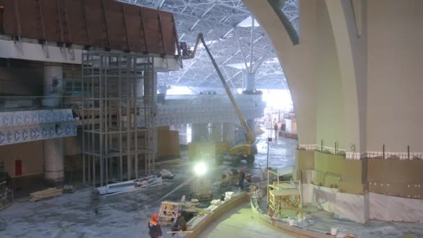 Welders welding steel on control tower — Stock Video