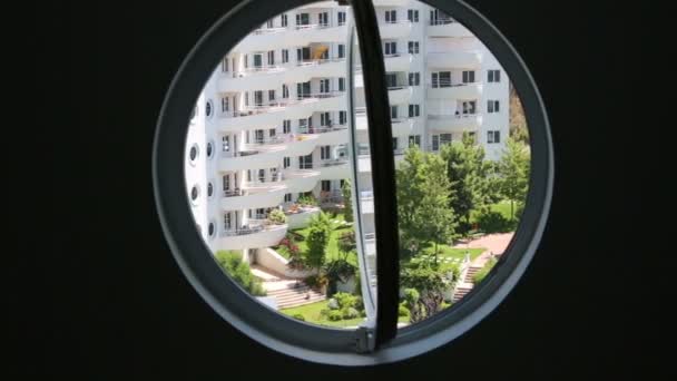 View through windows of green courtyard — Stock Video