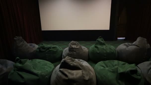 Screen with soft ottomans in cinema — Stock Video