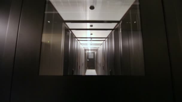 Door in corridor with telecommunication racks — Stock Video