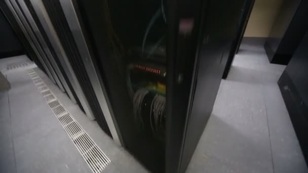 Server room with telecommunication racks and cables — Stock Video