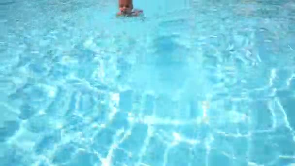 Little cute boy swims in pool — Stock Video