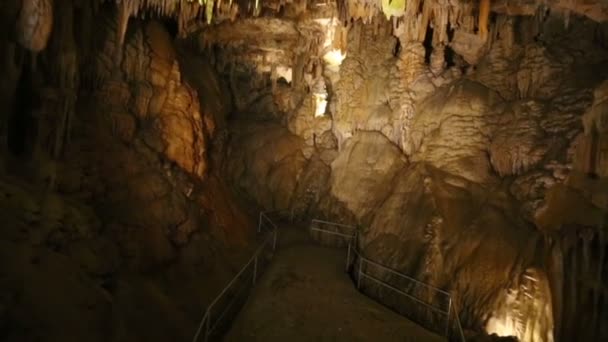 Fenced walkway in old subterranean cave — Stock Video