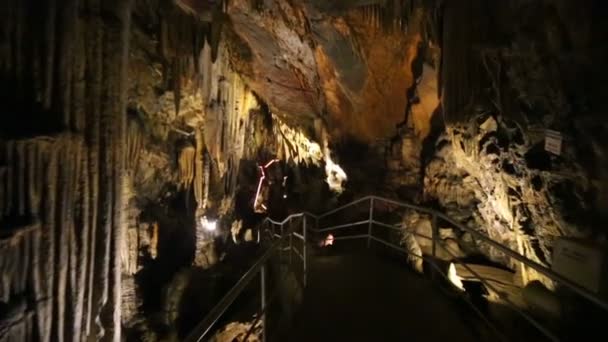 Fenced walkway in old subterranean cave — Stock Video