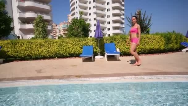 Young beautiful woman in swimsuit — Stock Video