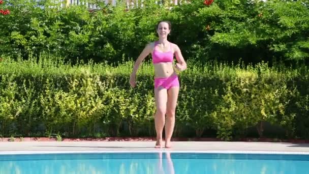 Young beautiful woman does exercises — Stock Video