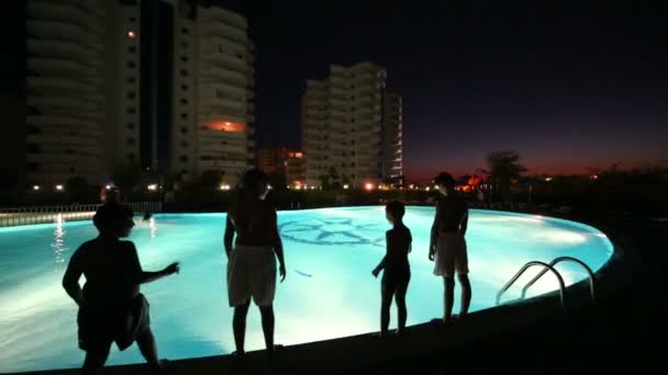 Four boys dive into pool — Stock Video