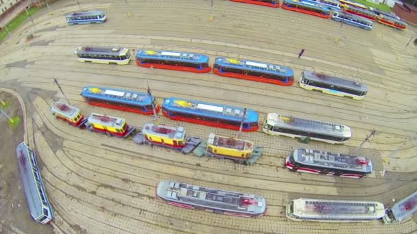 Several type of trams in city depot, above view — Stock Video