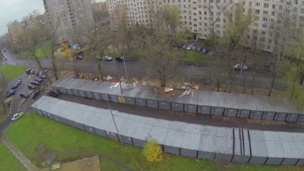 Truck rides by wet street near garages at autumn day in Moscow — Stock Video