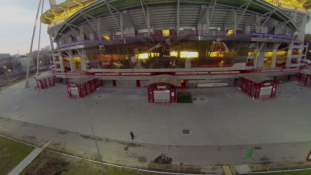 Security men near illuminated soccer stadium — Stock Video