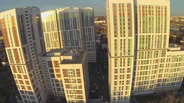 Cityscape with residential complex lit by sunlight — Stock Video