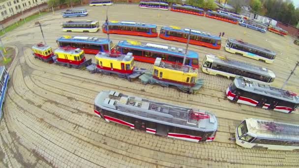 Tram depot plateau with many tram models, above view — Stock Video