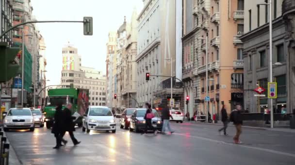 Pedestrians cross Gran Via street — Stock Video