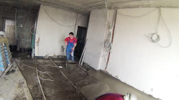 Workers fixing level of new floor — Stock Video