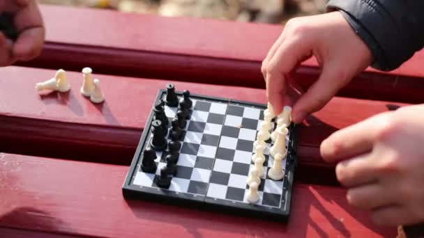 Hands of grandmother and boy with chessboard — Stock Video