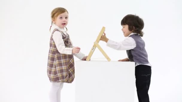 Little girl and boy with abacus — Stock Video