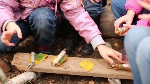 Children play in food at autumn park — Stock Video