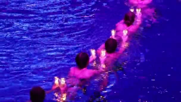 Women swim with candles — Stock Video