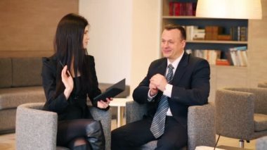 Woman with notepad and man