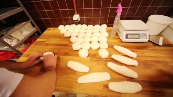 Workers knead white dough for bread — Wideo stockowe