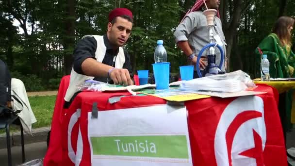 Representative of Tunisia and tables with national symbols — Stock Video