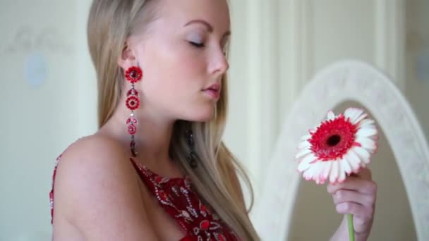 Beautiful girl with flower at hand — Stock Video