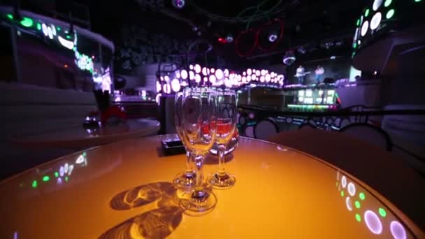 Orange round tables with wine glasses — Stock Video