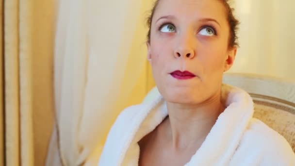 Beautiful young girl in bathrobe — Stock Video