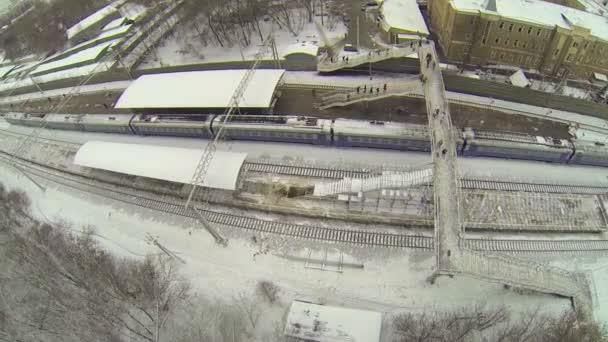 Departure of train from railroad station at winter — Stock Video