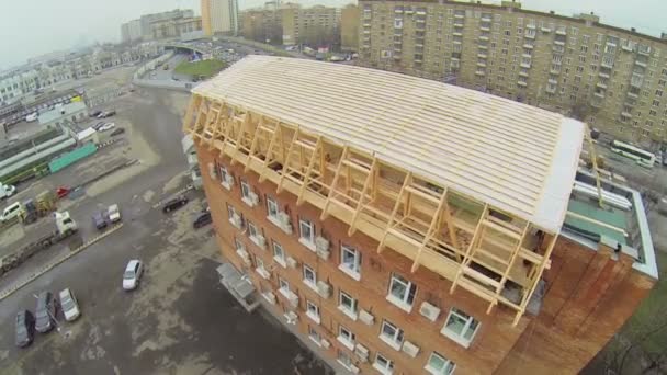 Wooden structure of roof on brick building — Stockvideo