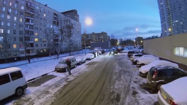 Car rides near dwelling houses — Stock Video