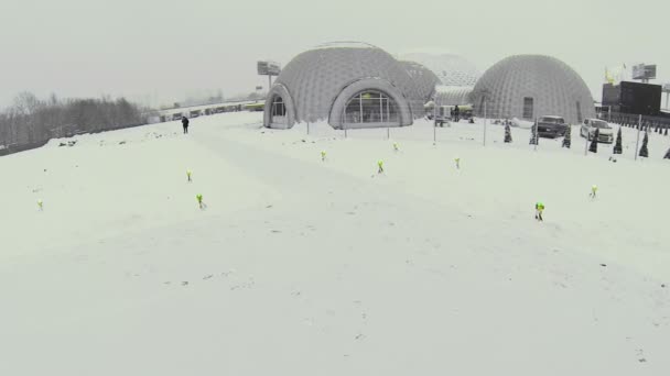 Snowbound airfield near spherical hangars — Stock Video