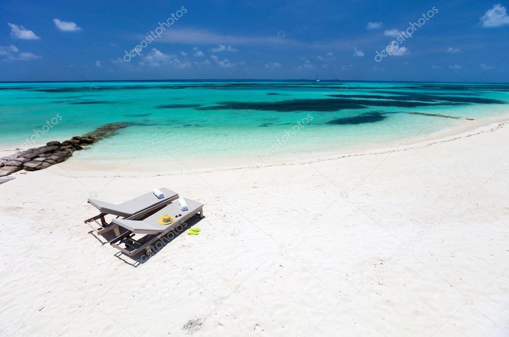 Lounge chairs on a beach