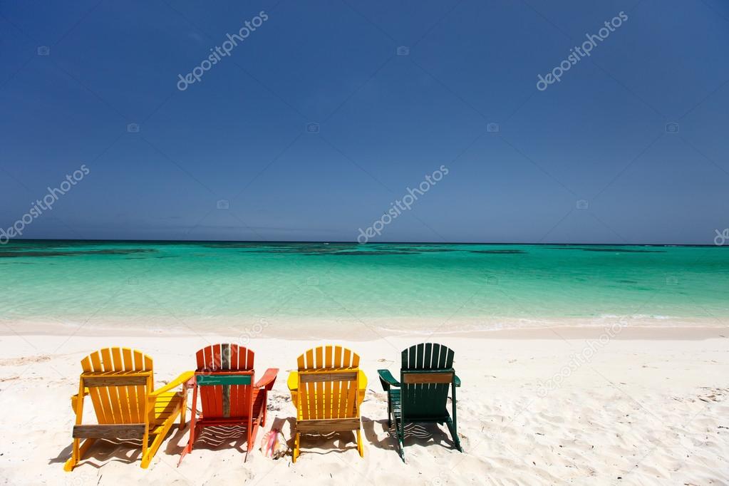 Colorful chairs on Caribbean beach