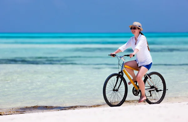 Young woman biking Stock Photo