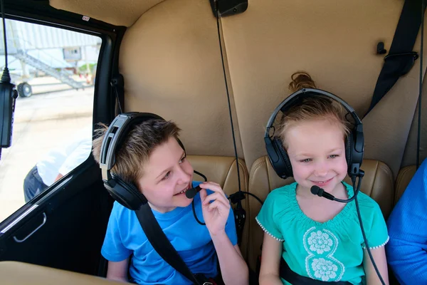 Kids at cabin of helicopter — Stock Photo, Image