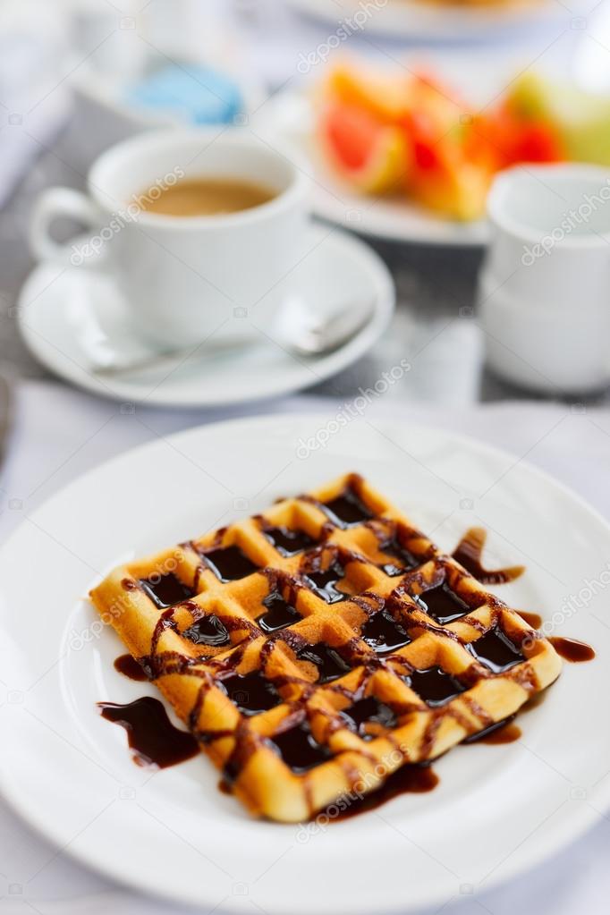 Delicious waffles with coffee