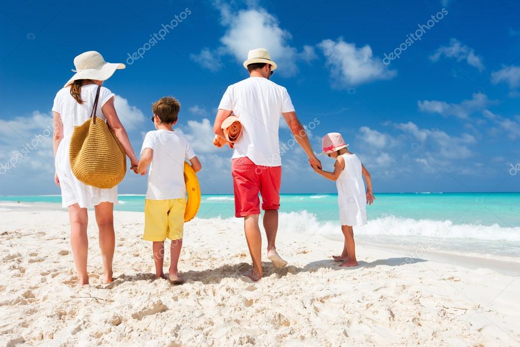 Family with kids on beach vacation