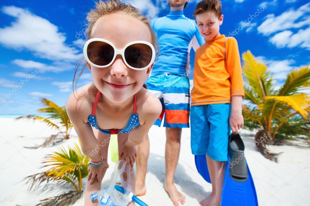 Father with kids at beach