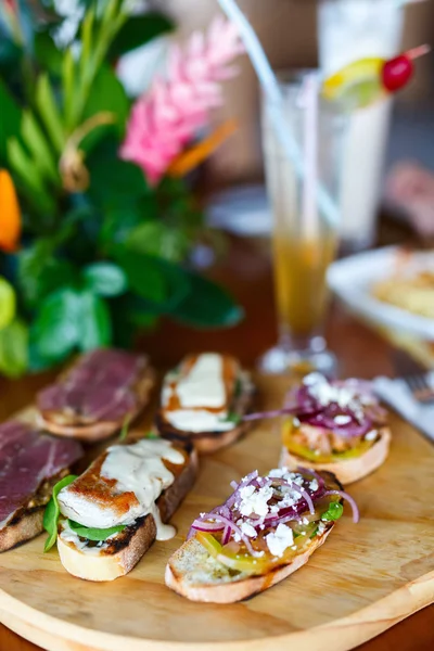 Delicious bruschettas platter — Stock Photo, Image