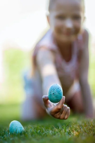 Little girl on Easter eggs hunt — Stock Photo, Image