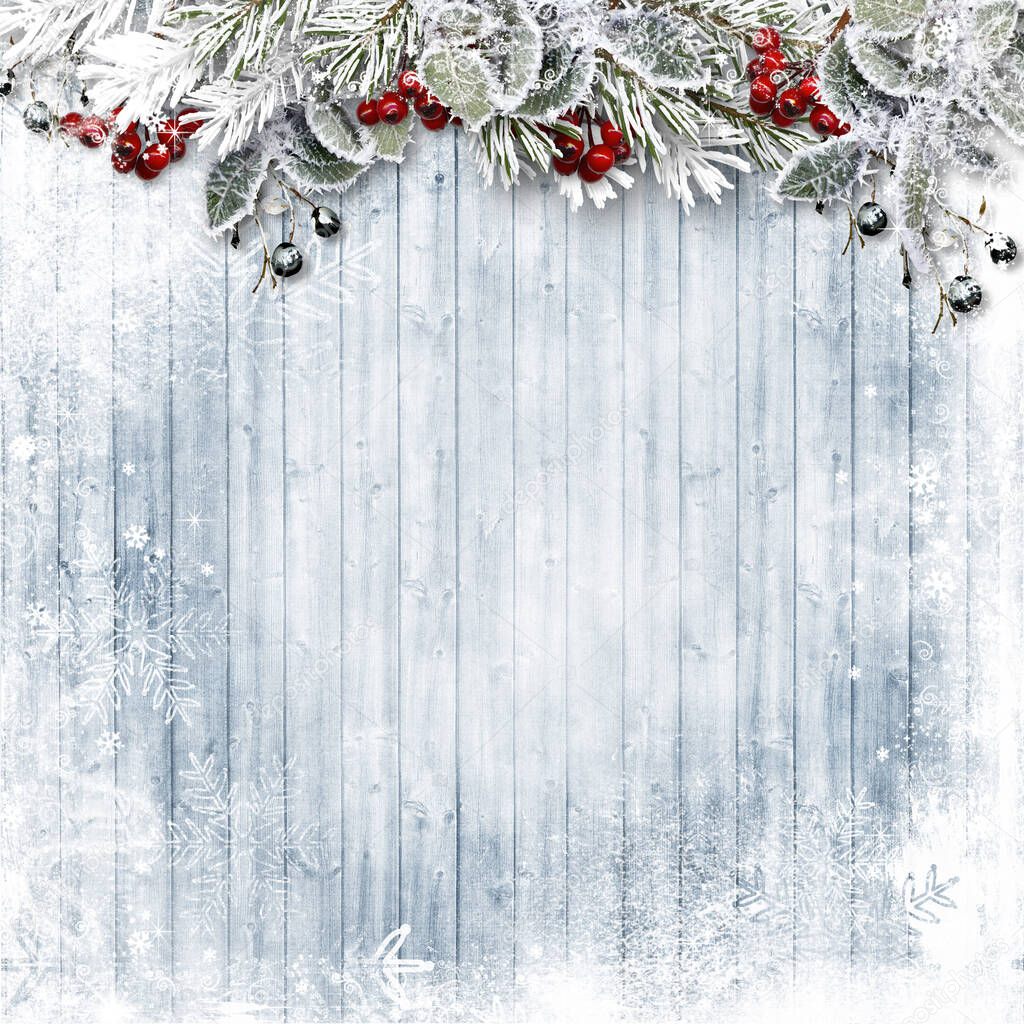 Christmas Holiday wood background with snow, holly and firtree. Copy space