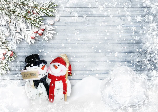 Tarjeta de Navidad con muñecos de nieve — Foto de Stock