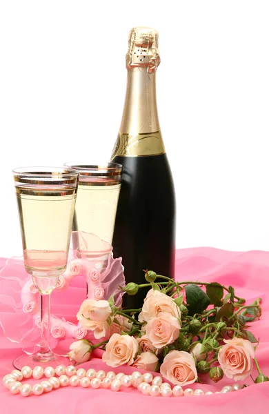Champagne and roses on a white background — Stock Photo, Image