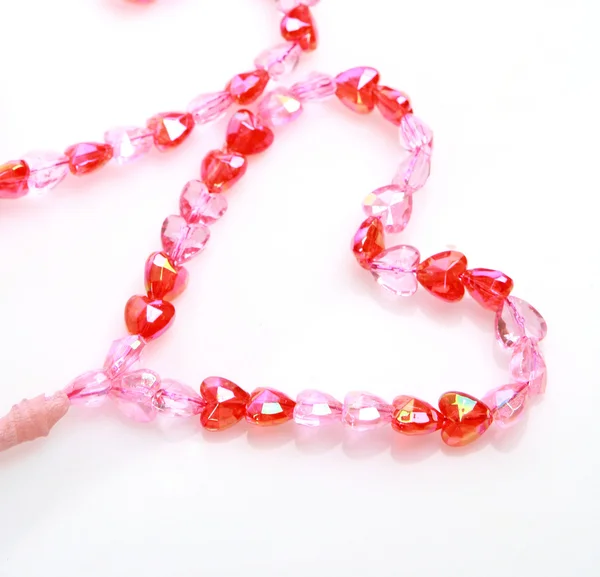 Decorative heart made of pink beads — Stock Photo, Image